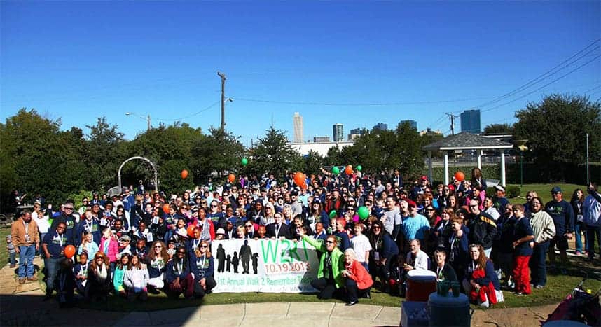 A huge crowd poses near the start of The WARM Place's annual fundraising walkathon in Fort Worth, TX.