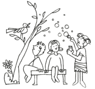 children blowing bubbles and sitting under a tree