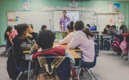 A teacher and students during class.