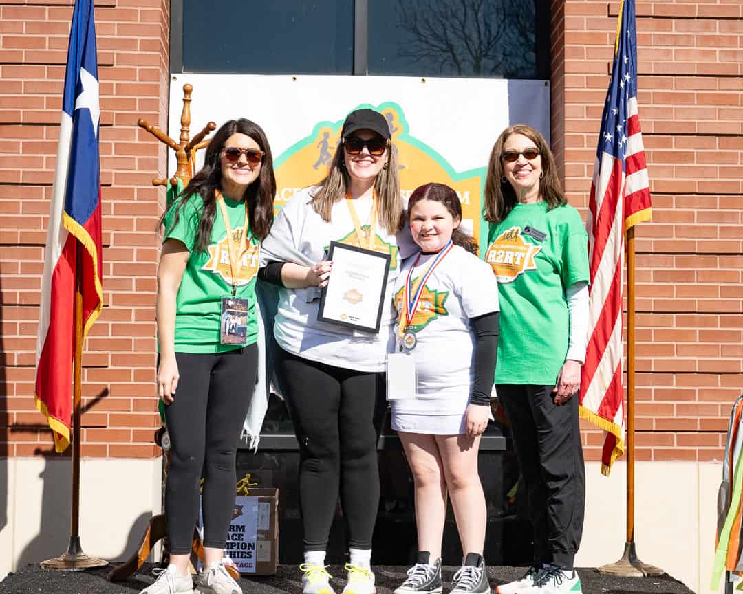 Allison and Harper receiving their WARM Place Warrior award for Team Lance at R2RT 2025 