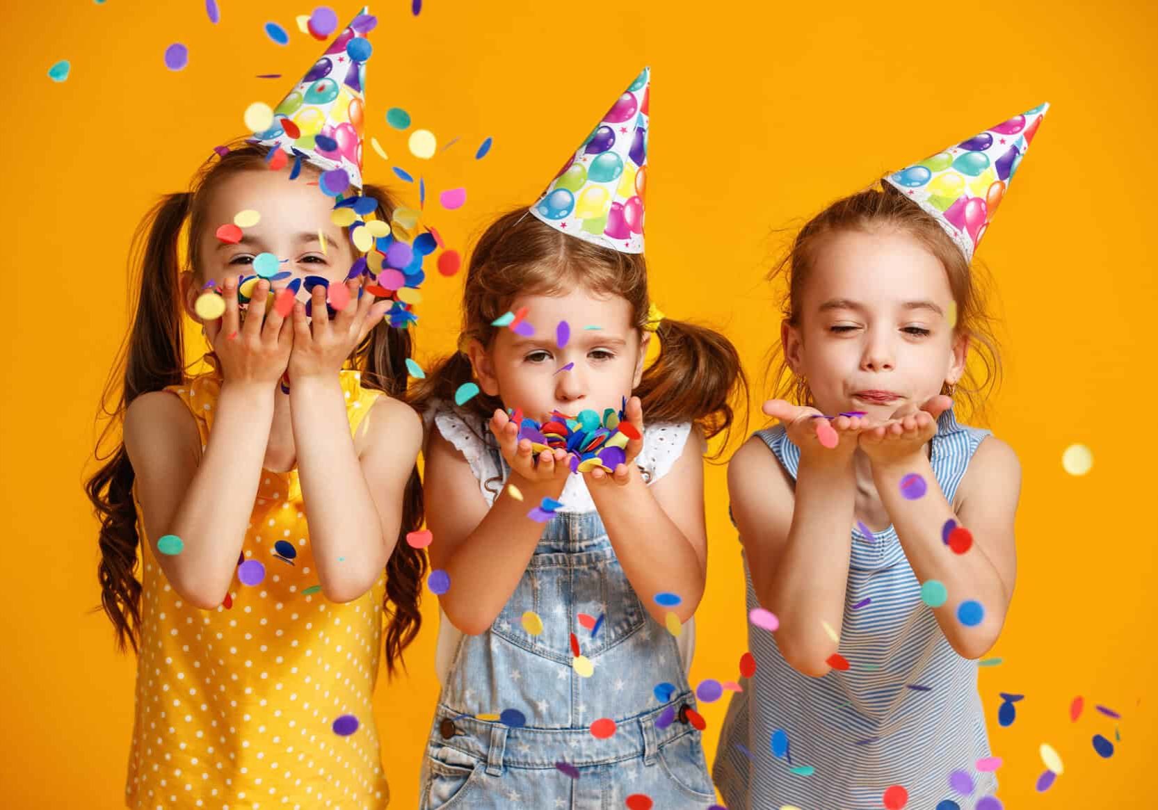 Happy,Birthday,Children,Girls,With,Confetti,On,Colored,Yellow,Background