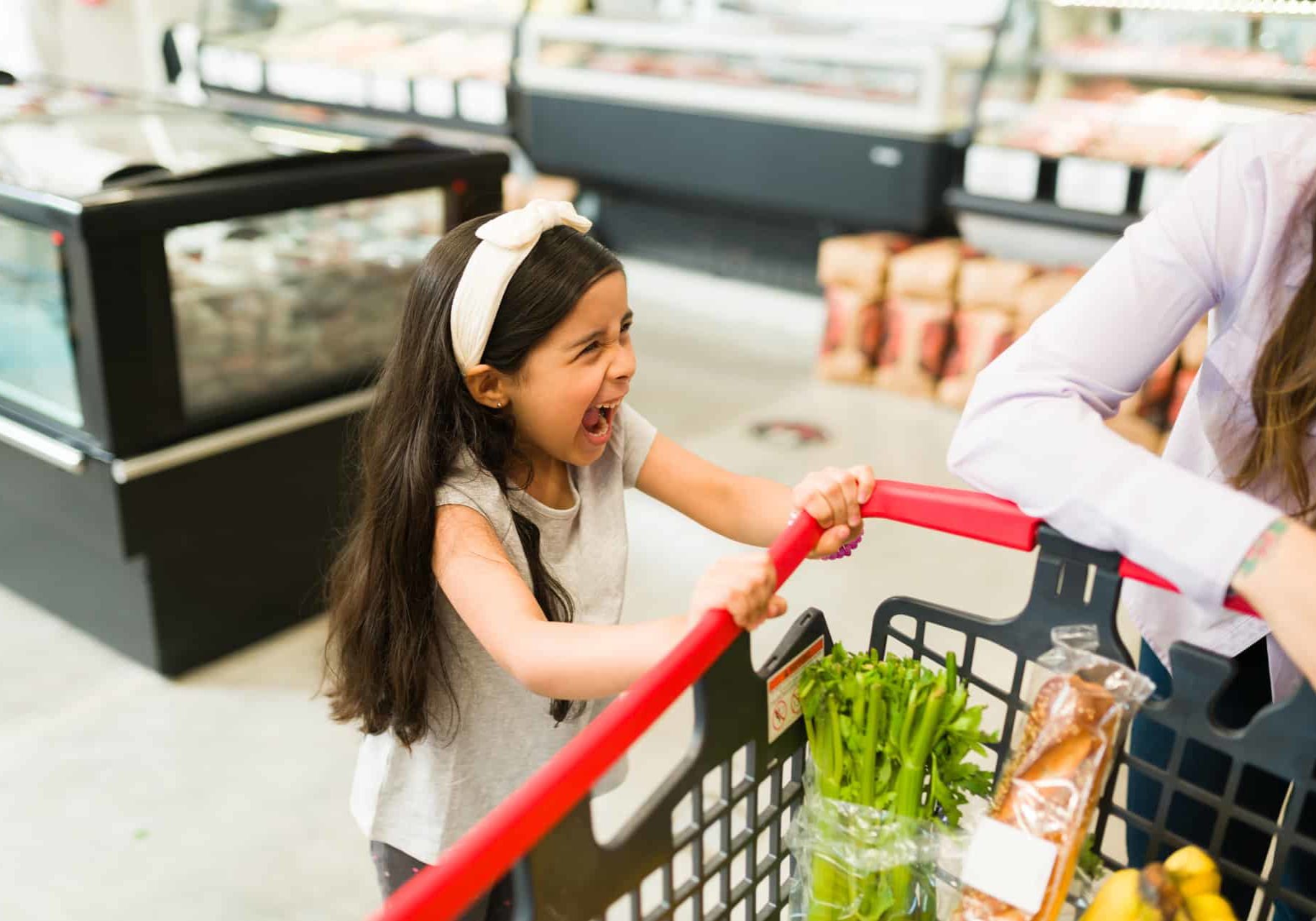 Angry,Little,Kid,Screaming,And,Throwing,A,Tantrum,While,Grocery