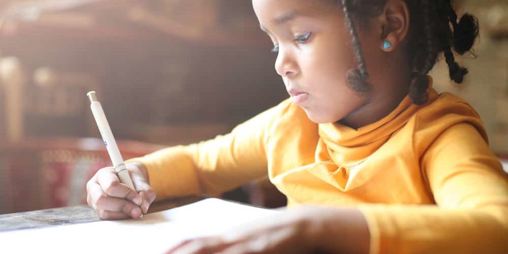 Profile,Of,Little,African,Girl,Writing,At,Home.