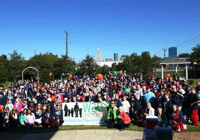 A huge crowd poses near the start of The WARM Place's annual fundraising walkathon in Fort Worth, TX.